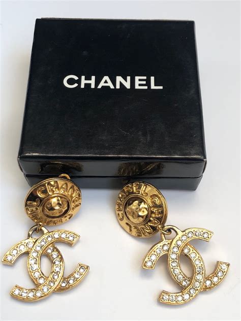 chanel earrings plastic round|Chanel symbol earrings.